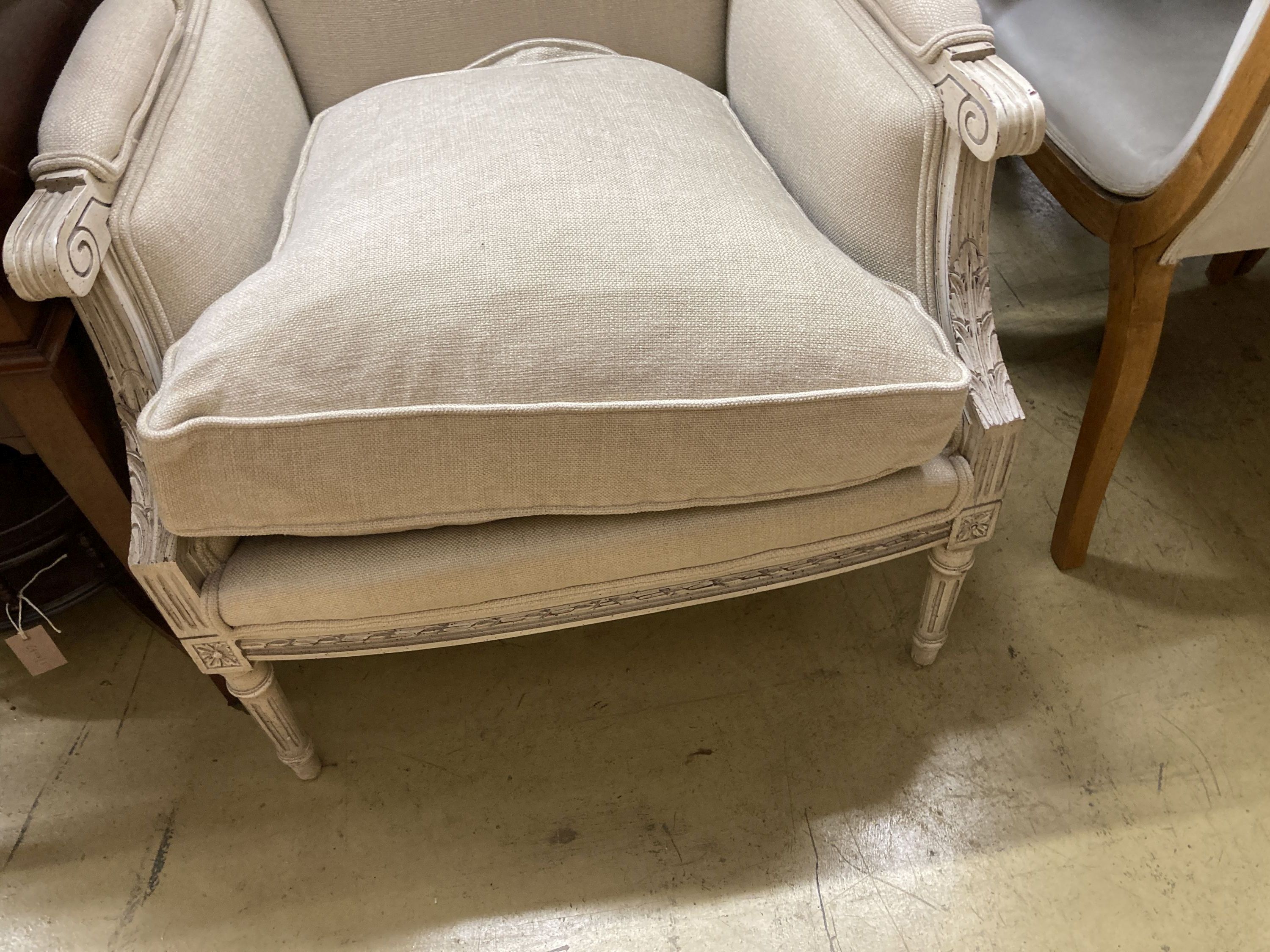 A pair of painted French style upholstered armchairs, width 70cm, depth 70cm, height 96cm